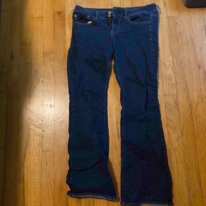 Dark, wide legged jeans, size 8.